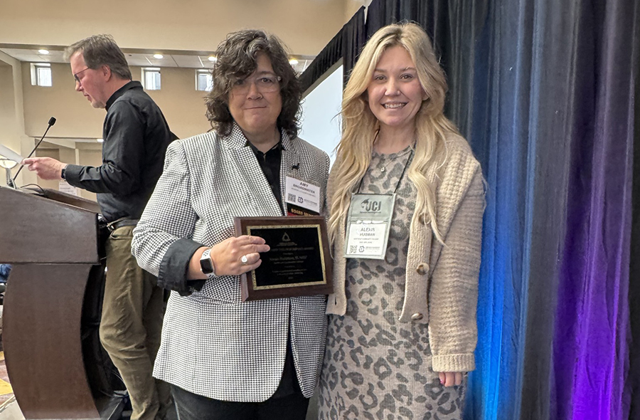 Alexis Huisman being presented award