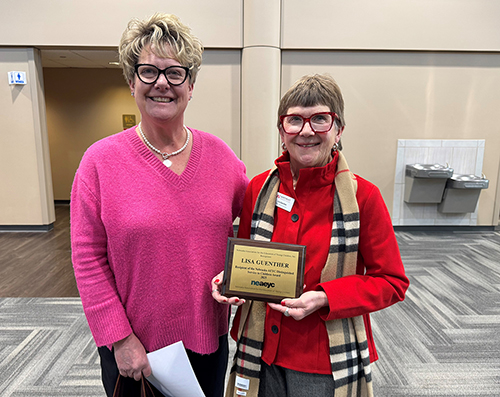 Lisa Guenther holding service award