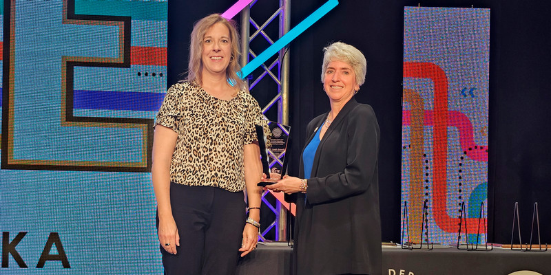 Northeast President Leah Barrett (right), accepts an award from Elizabeth Tegtmeier, president of the Nebraska State Board of Education.
