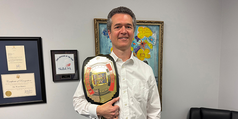 Wade Herley holding award belt