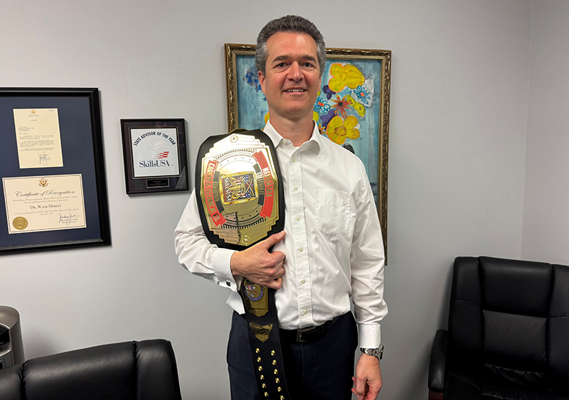 Wade Herley holding award belt