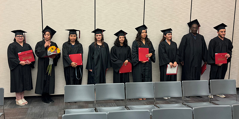 Adult Ed Students Lined Up After Getting Diplomas