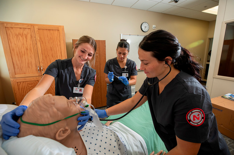  Northeast Community College nursing students practice patient assessment skills using advanced simulation technology in the College’s nursing lab, preparing for real-world clinical experiences and careers in healthcare.