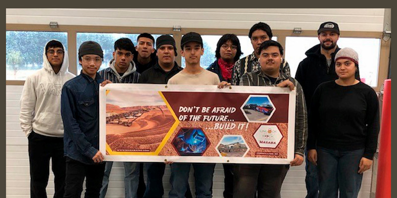South Sioux City students holding ceremonial check.